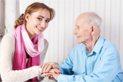 lady holding old man's hand